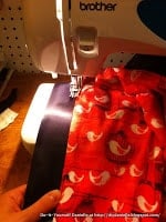 Sewing satin binding on a baby blanket.