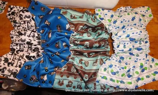 Four cloth diapers laid out for sewing