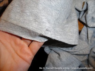 Seam ripping the old hem on sweatpants.