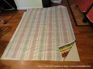Two different fabrics faced right sides together to make a picnic blanket.