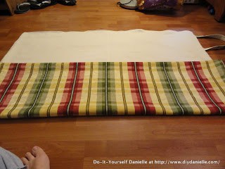 Folding the picnic blanket.