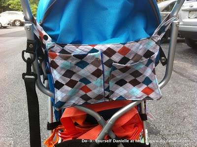 Organizer hooked onto the back of the umbrella stroller.