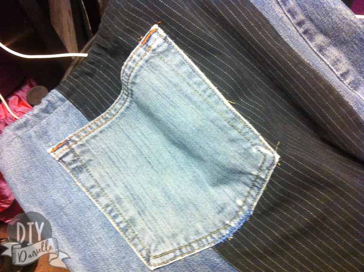 Pocket added to a jean skirt.
