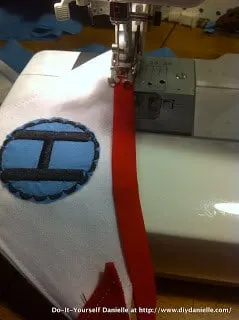 Using bias tape to sew the banner together.
