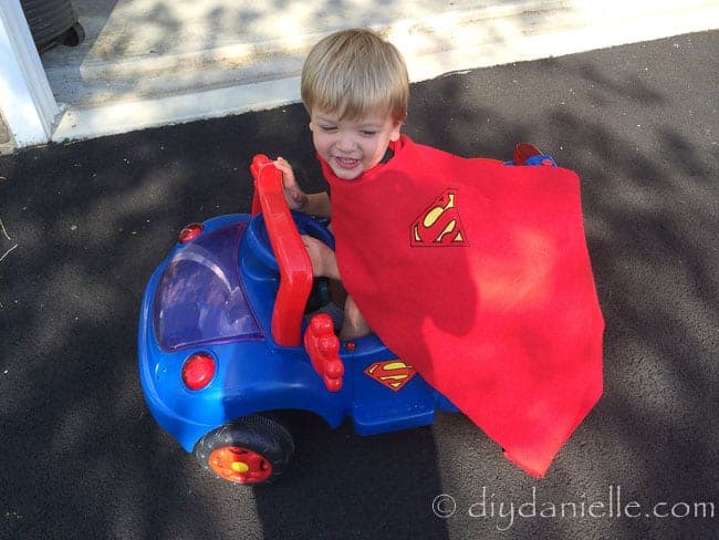 How to make a superhero cape without sewing. This is a no sew children's cape worn and a coordinating Superman car.