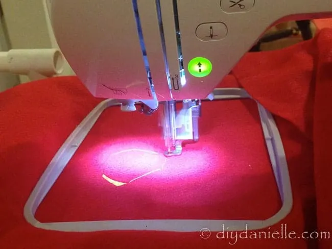 Embroidering a patch for a superhero cape. You can also use an iron on patch.