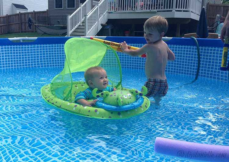 Kids playing in the above ground pool.