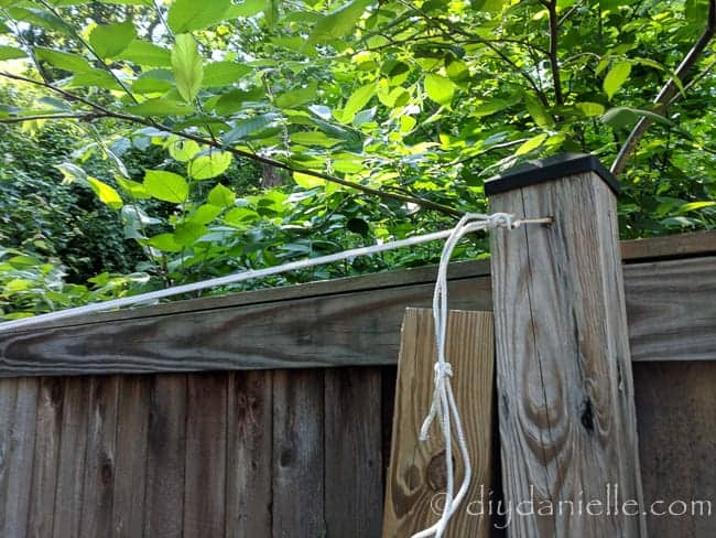 Hook and rope used to hold the shade sail over the sandbox.