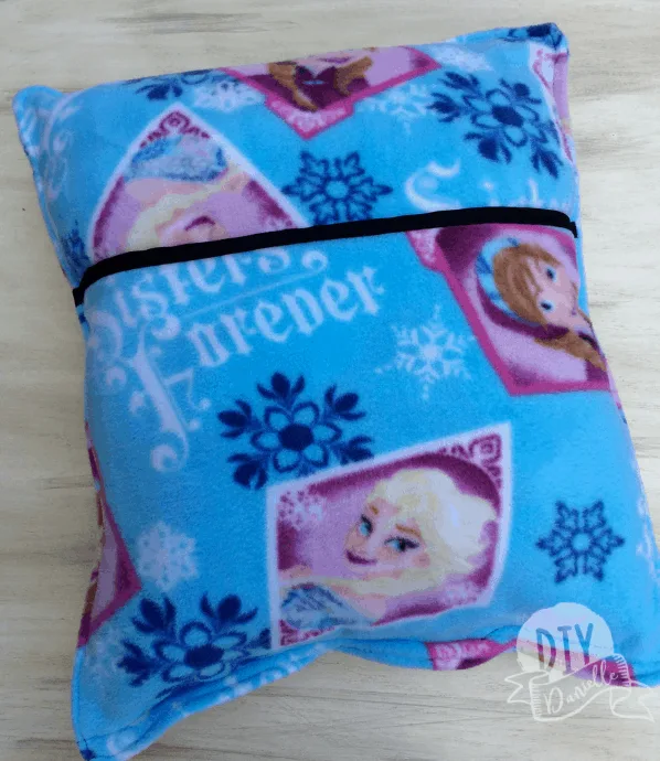 Fleece pillow with Frozen fabric with a pocket added to tuck a book inside.