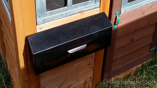 Mailbox on a playhouse for the kids to play mailman.