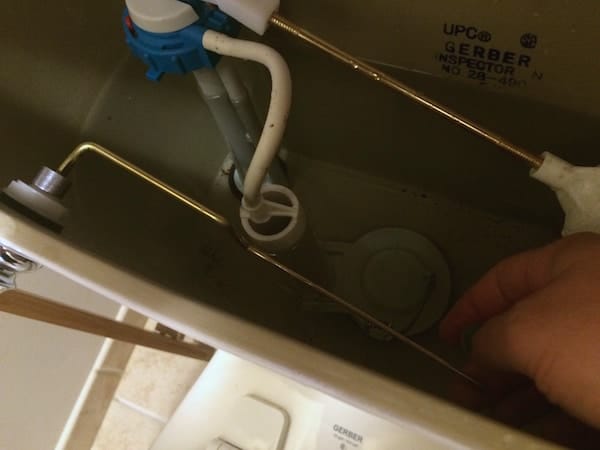 Replacement level inside the toilet when fixing a toilet handle.