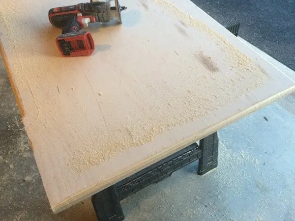 Standing the wood desk top. This piece of wood functions as a cover for the board games or puzzles. You'll be able to use this as a desk without disturbing your game progress.