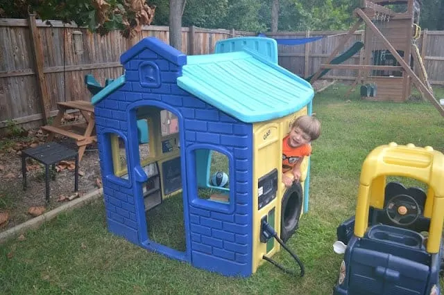 Blue and yellow plastic playhouse.