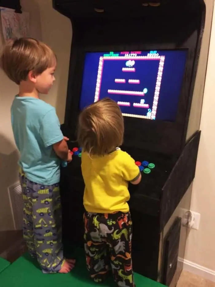 Kids playing on DIY arcade machine