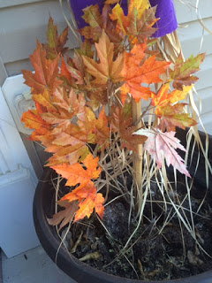 Using an empty planter to make porch decor.