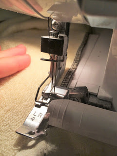 Serging my spa wrap fabric. 