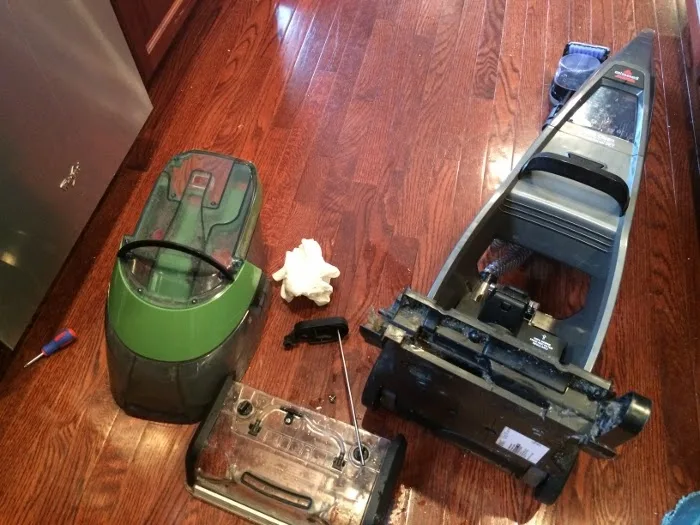 Taking apart your steam cleaner to clean it out.