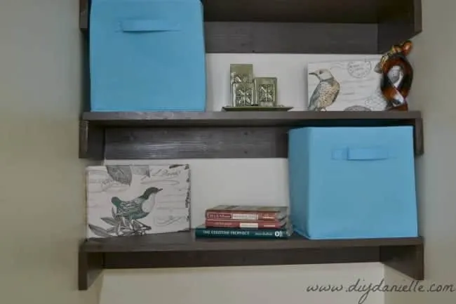 Close up of our small bathroom shelving and decor.