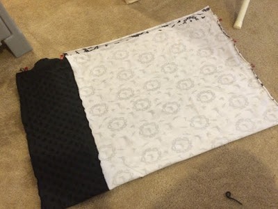 Pinning pillowcase fabric right sides together.