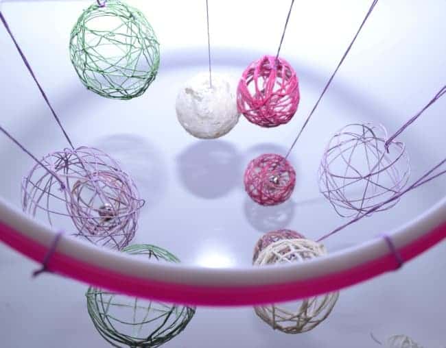 A photo of the Easter eggs hanging from the embroidery hoop.