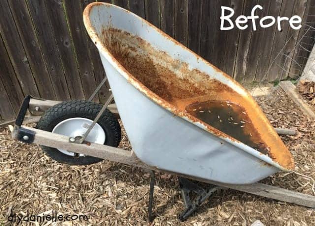 Old, rusted wheelbarrow.