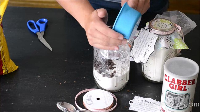 Adding ingredients for cake mix cookies to DIY Cookie Mix Mason Jar