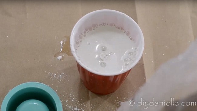 Mixing small amounts of concrete for a silicone mold.