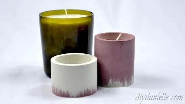 Soy candles made with nadmade concrete and wine bottle candle holders.