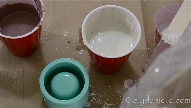 Cement mix for craft use, making concrete candle holders. These two are pink and white.