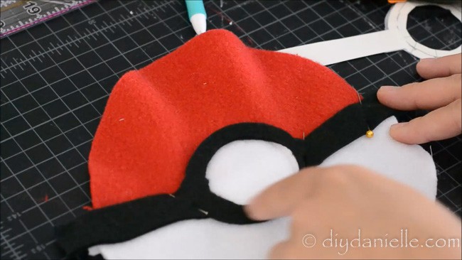 Adding black and white center to fabric Pokeball design.