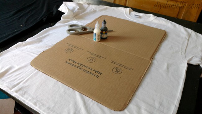 Cardboard template with other supplies for a Cards Against Humanity costume.