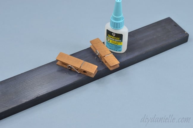 Use a good adhesive to glue the clips onto your wood.
