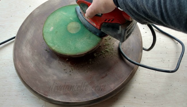 Sanding a thrift store lazy susan.