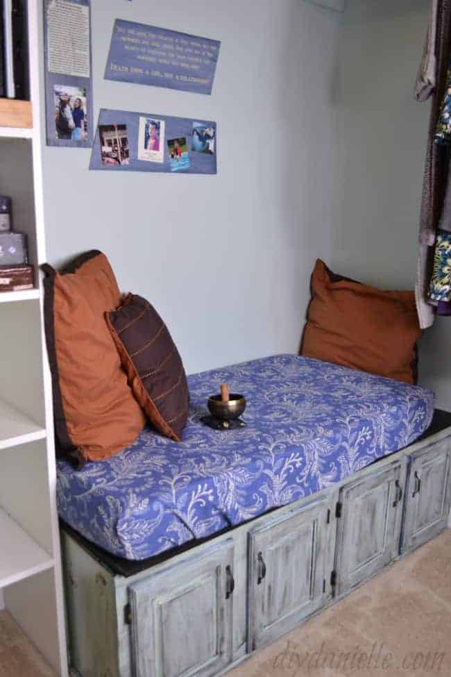 Small seating area in a master closet.