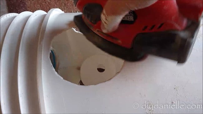 Sanding edges of the holes so the ducks wouldn't get cut by edges.