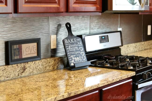 DIY Kitchen Backsplash that matches with stainless steel appliances.