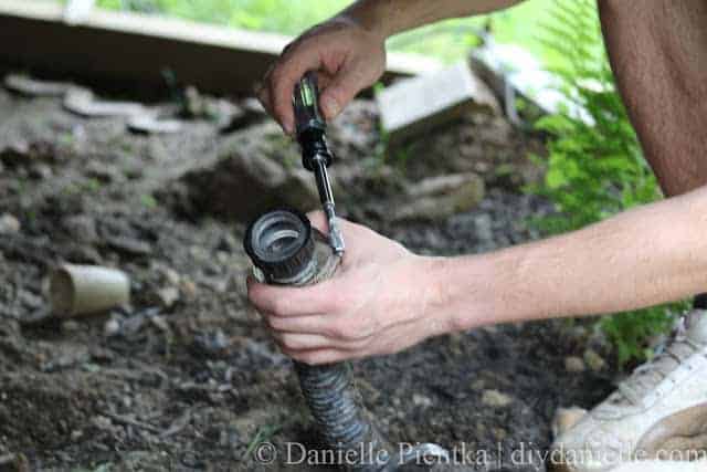 Tighten hose clamp around the tubing.