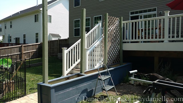 Painted privacy planters with trim.