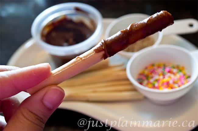 Coat your breadsticks in chocolate or another topping.