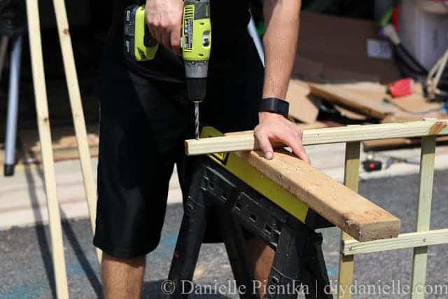 Holes being drilled in the top "leg" of the lattice.