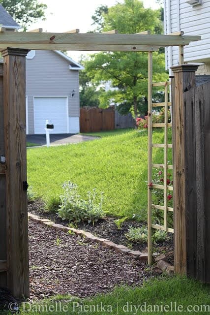 DIY Garden Arbor over a stone path.