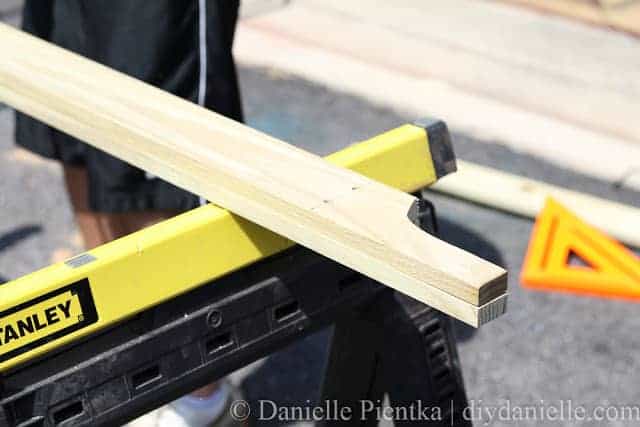 Holes being drilled for attaching garden arbor and lattice.