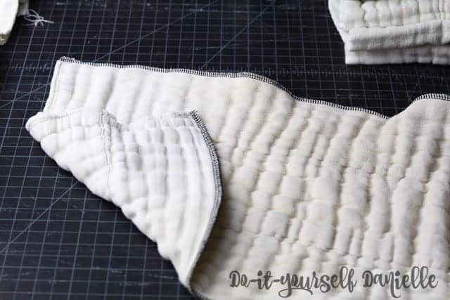 Serged edges of prefold diaper helps repair frayed edges.