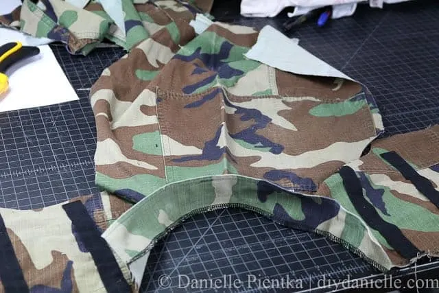 Sew on your collar for the Nerf vest. This one used upcycled camo.