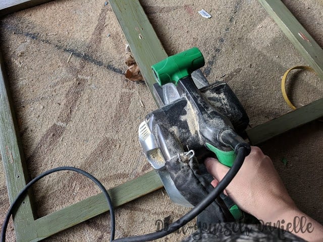 Sanding cabinet front down.