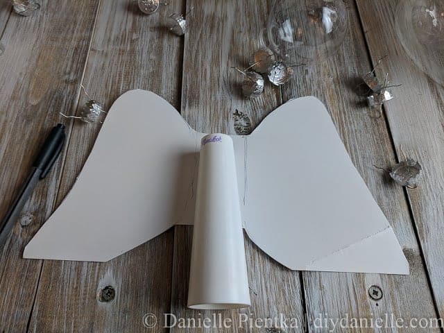 Thick cardboard cut for a Christmas tree angel.