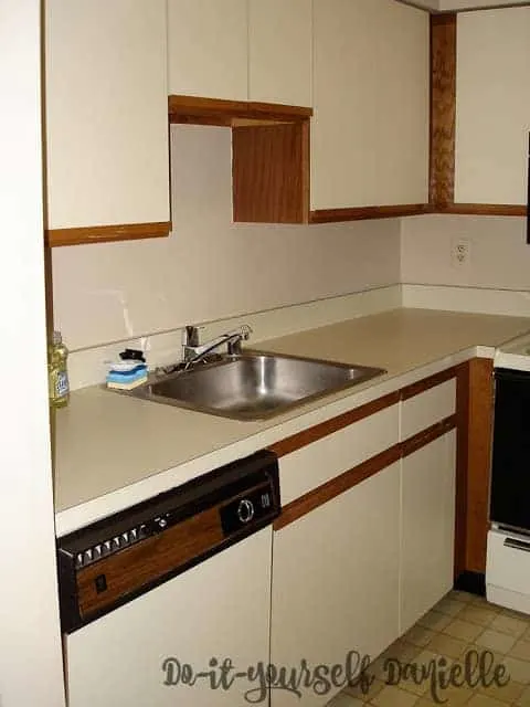 Laminate cabinets and counters in a small condo kitchen.