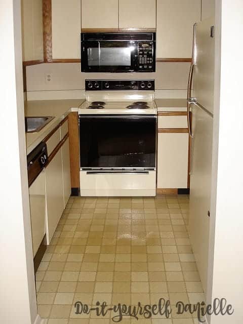 Laminate cabinets and counters in a small condo kitchen.