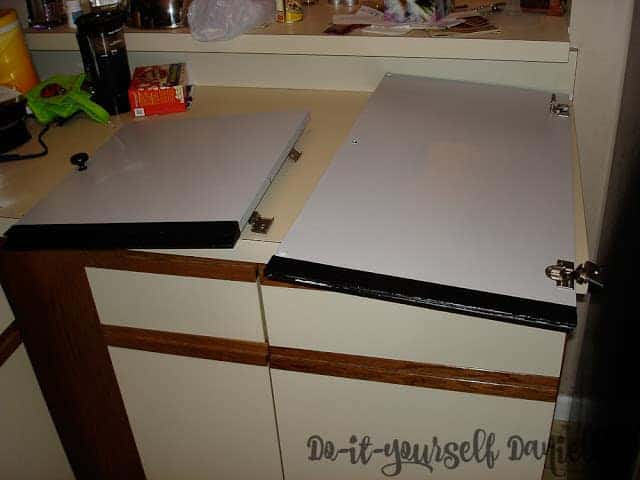 Primed and painted kitchen cabinets.