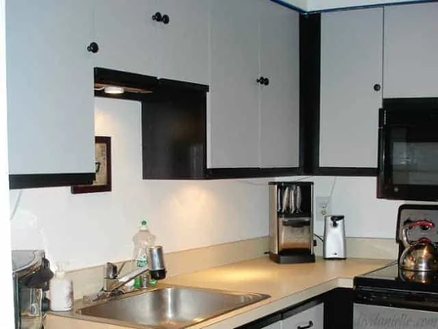 Laminate cabinets painted black and gray.